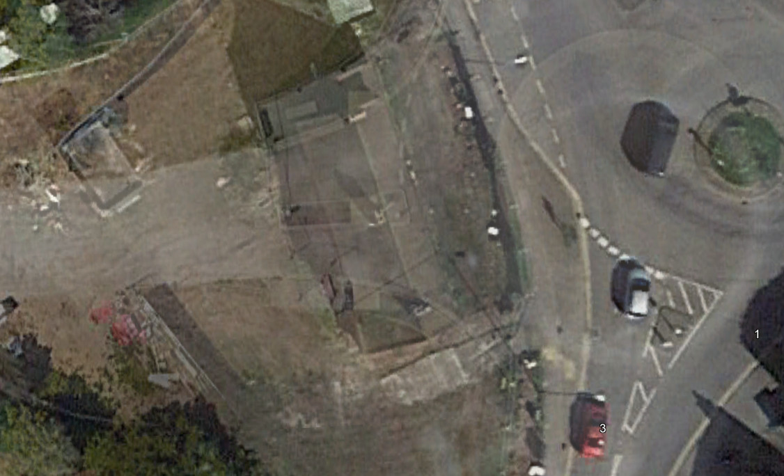 A composite image of two Google satellite photos - the 2017 image just before demoltion, and 2022 with a road running through the land.